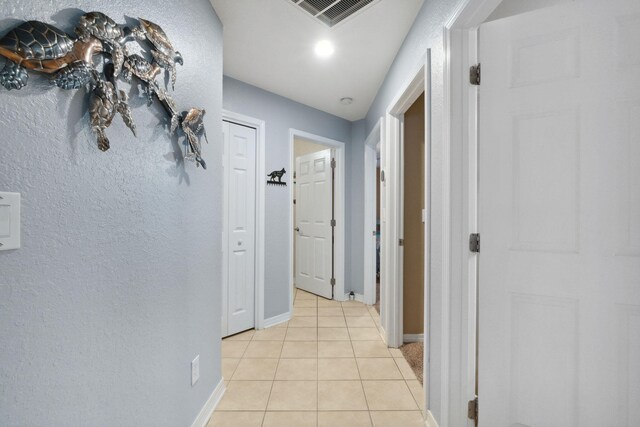 100 Kensington Cir, Panama City Beach, FL 32413 - corridor with light tile patterned floors and baseboards