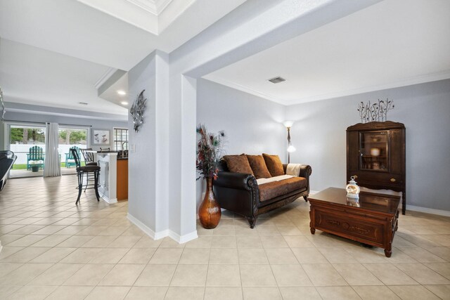 100 Kensington Cir, Panama City Beach, FL 32413 - living area featuring ornamental molding, light tile patterned floors, and baseboards