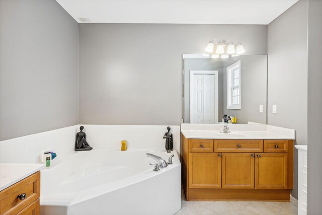 100 Kensington Cir, Panama City Beach, FL 32413 - full bathroom with vanity, a bath, and tile patterned floors