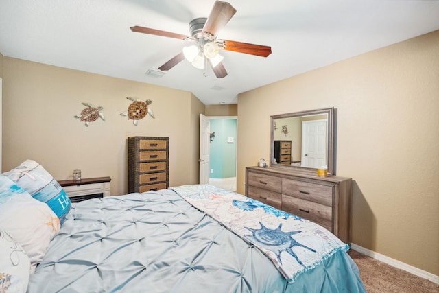 100 Kensington Cir, Panama City Beach, FL 32413 - carpeted bedroom with baseboards and a ceiling fan
