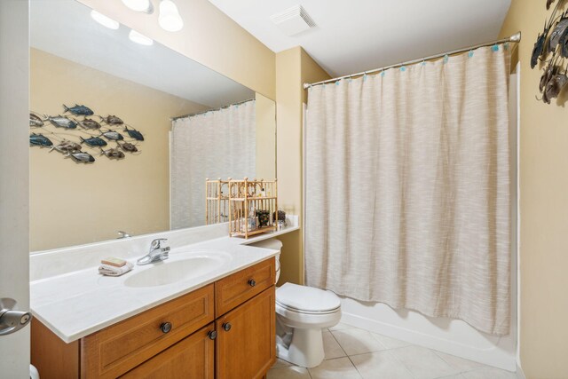 100 Kensington Cir, Panama City Beach, FL 32413 - full bath featuring tile patterned flooring, toilet, vanity, and shower / tub combo