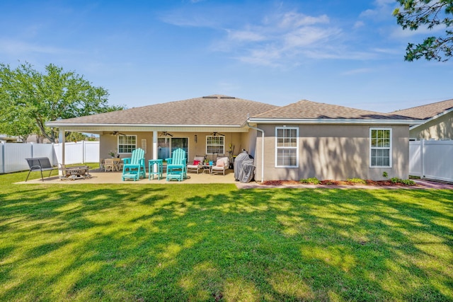 100 Kensington Cir, Panama City Beach, FL 32413 - back of property with ceiling fan, stucco siding, an outdoor living space with a fire pit, a patio, and a shingled roof