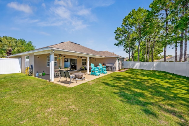 100 Kensington Cir, Panama City Beach, FL 32413 - back of property with an outdoor fire pit, a ceiling fan, stucco siding, and a patio area