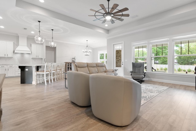 5362 Wyndell Cir, Crestview, FL 32539 - living area featuring ceiling fan, recessed lighting, light wood-style floors, and a tray ceiling