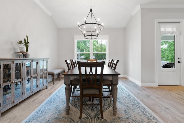 5362 Wyndell Cir, Crestview, FL 32539 - dining room featuring lofted ceiling, a chandelier, wood finished floors, ornamental molding, and baseboards