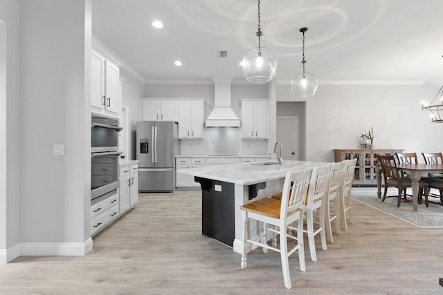 5362 Wyndell Cir, Crestview, FL 32539 - kitchen with stainless steel fridge, custom range hood, ornamental molding, a sink, and backsplash