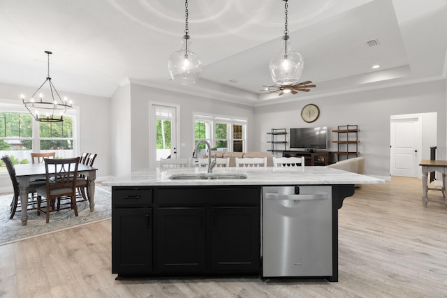 5362 Wyndell Cir, Crestview, FL 32539 - kitchen with dishwasher, a sink, a raised ceiling, dark cabinetry, and open floor plan