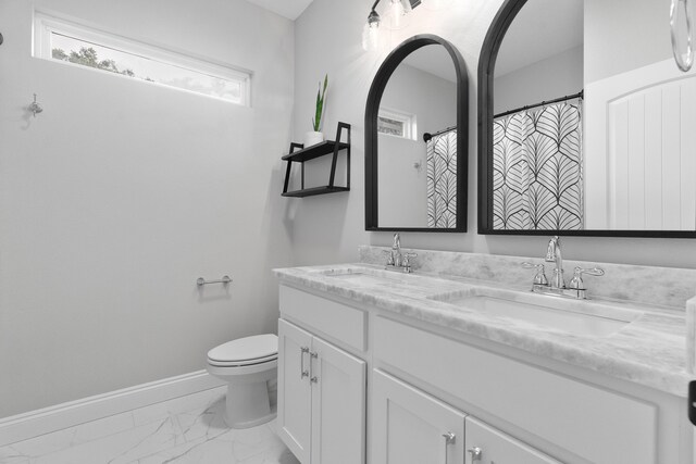 5362 Wyndell Cir, Crestview, FL 32539 - full bath featuring marble finish floors, double vanity, toilet, and baseboards