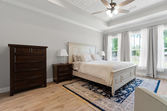 5362 Wyndell Cir, Crestview, FL 32539 - bedroom with a raised ceiling, baseboards, light wood-style flooring, crown molding, and ceiling fan