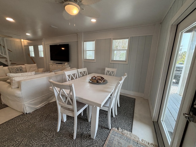 101 Barbados Dr, Cape San Blas, FL 32456 - dining room with a ceiling fan, a decorative wall, stairs, and recessed lighting