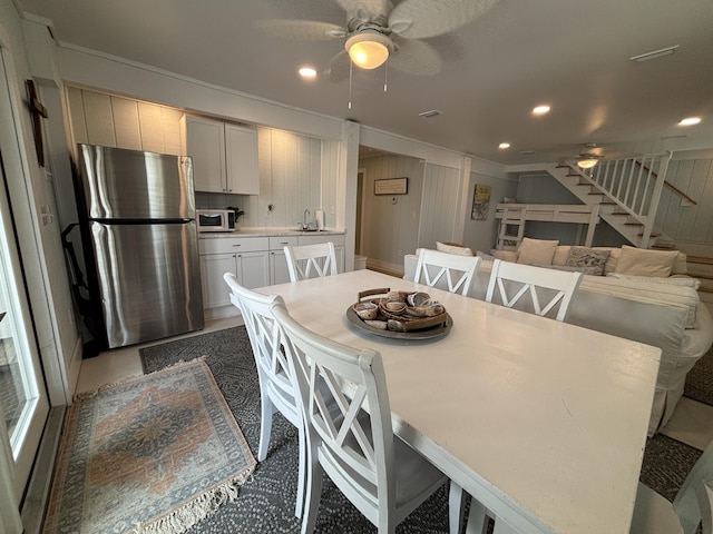 101 Barbados Dr, Cape San Blas, FL 32456 - dining space featuring a ceiling fan, stairs, recessed lighting, and crown molding