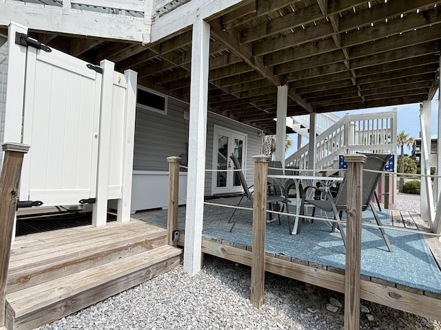101 Barbados Dr, Cape San Blas, FL 32456 - wooden deck with french doors and stairway