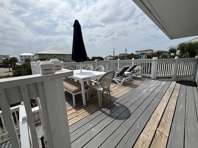 101 Barbados Dr, Cape San Blas, FL 32456 - wooden deck with outdoor dining area