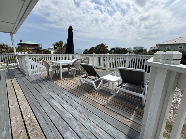 101 Barbados Dr, Cape San Blas, FL 32456 - wooden deck with outdoor dining area