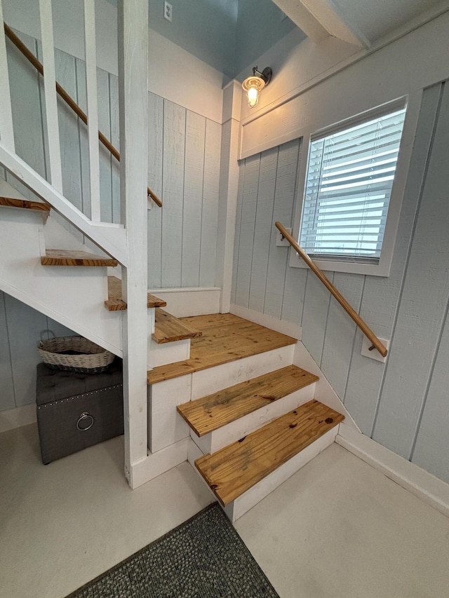 101 Barbados Dr, Cape San Blas, FL 32456 - staircase with beamed ceiling and concrete flooring