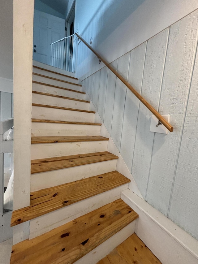 101 Barbados Dr, Cape San Blas, FL 32456 - staircase featuring wood finished floors
