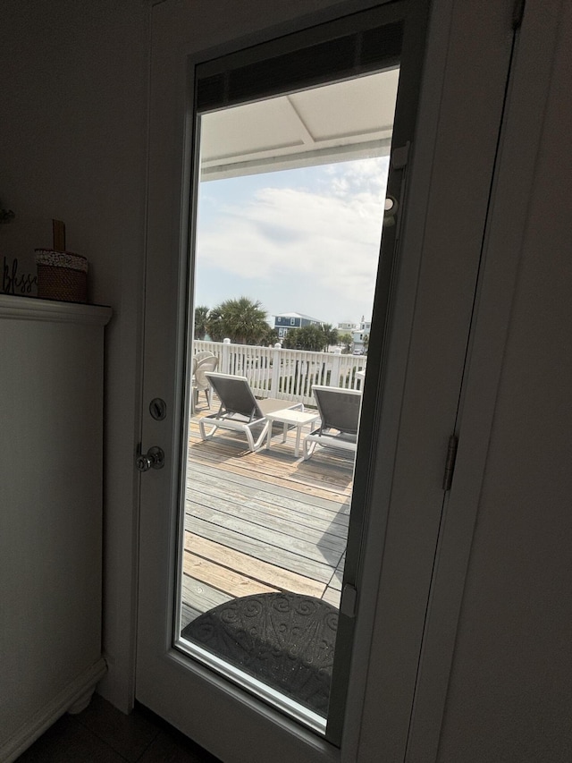 101 Barbados Dr, Cape San Blas, FL 32456 - doorway to outside with dark tile patterned floors