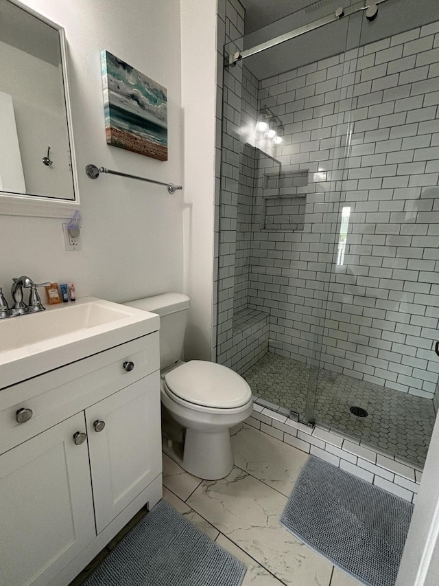 101 Barbados Dr, Cape San Blas, FL 32456 - bathroom with marble finish floors, a shower stall, toilet, and vanity