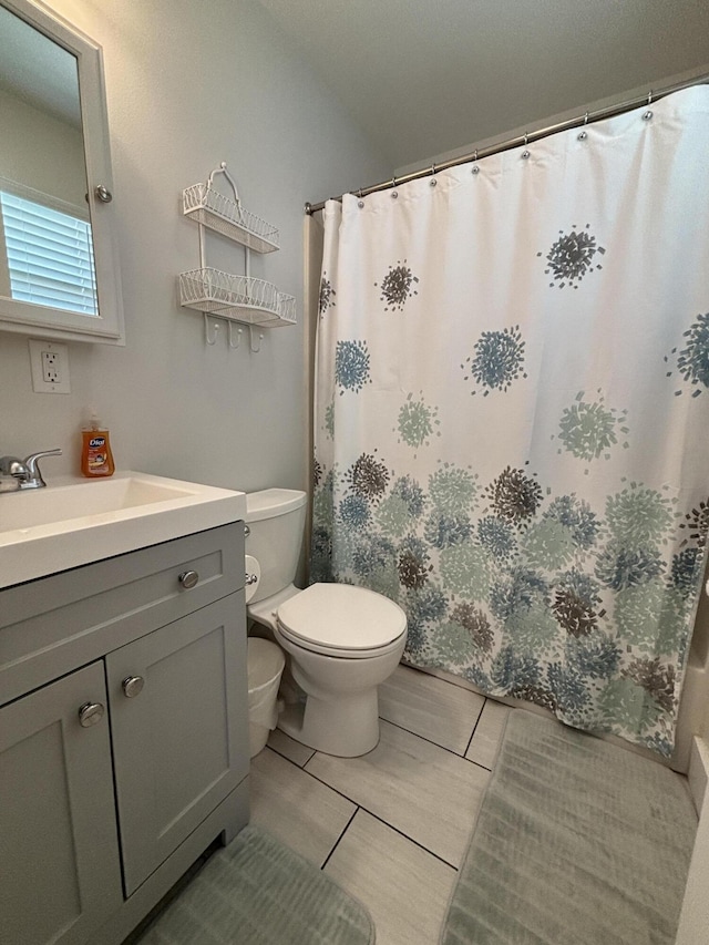 101 Barbados Dr, Cape San Blas, FL 32456 - bathroom featuring toilet, vanity, and curtained shower