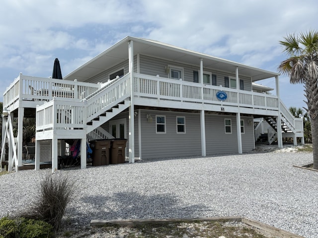 101 Barbados Dr, Cape San Blas, FL 32456 - back of property featuring stairs and a wooden deck