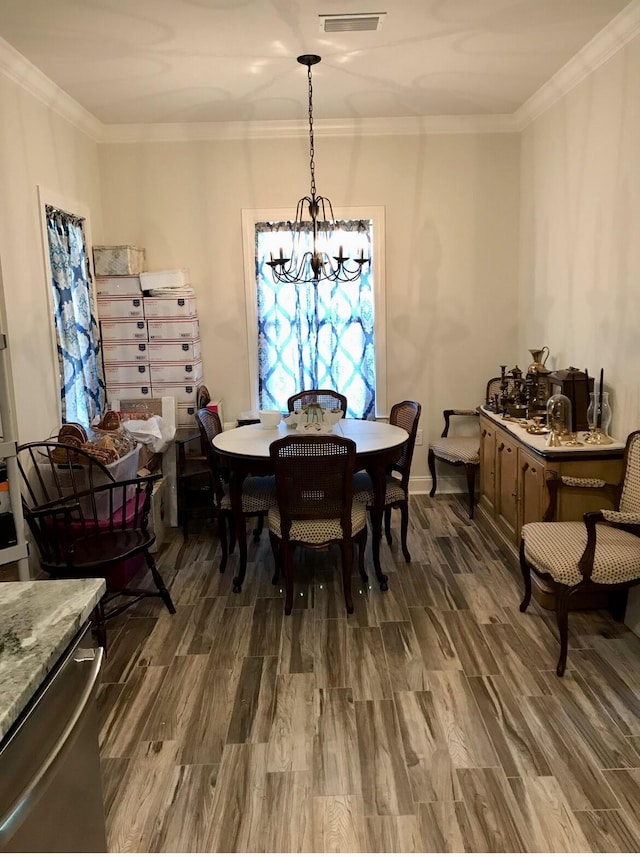 95 Santana Dr, Santa Rosa Beach, FL 32459 - dining space with a chandelier, wood finished floors, and ornamental molding