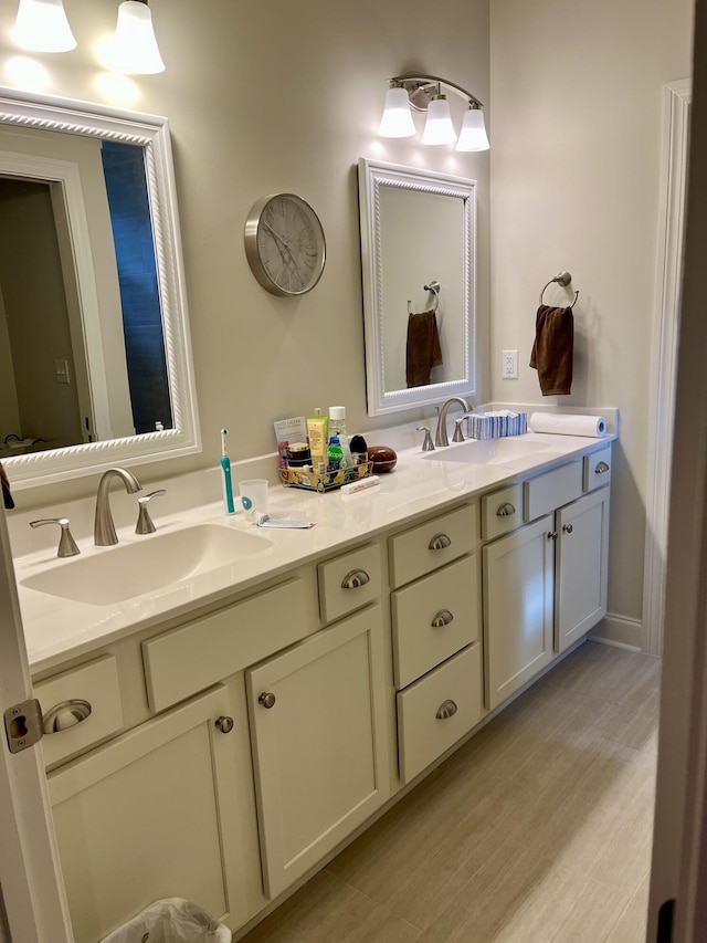 95 Santana Dr, Santa Rosa Beach, FL 32459 - bathroom with double vanity and wood finished floors