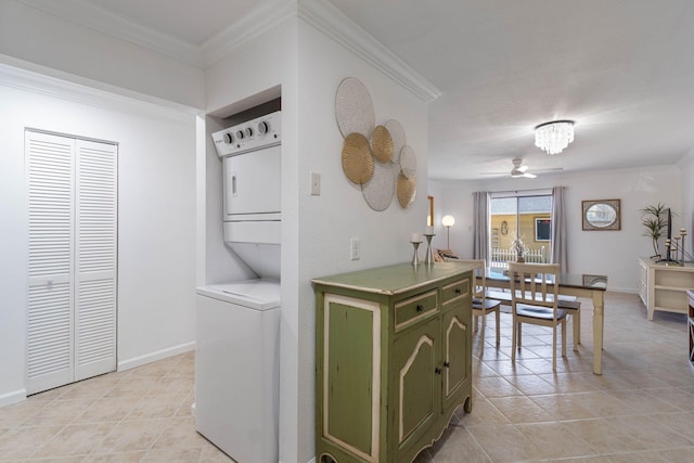 330 Bluefish Dr Unit 119, Fort Walton Beach, FL 32548 - kitchen with green cabinets, stacked washer and clothes dryer, ceiling fan, light tile patterned flooring, and crown molding