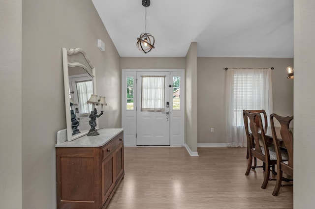 712 Riva Ridge Dr, Crestview, FL 32539 - entrance foyer with light wood finished floors and vaulted ceiling