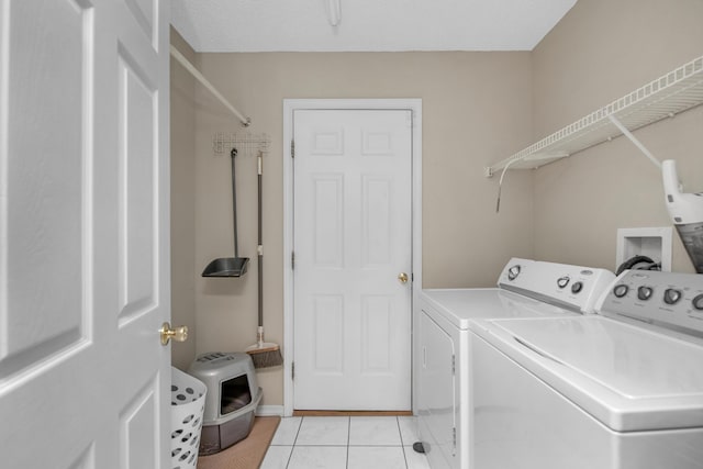 712 Riva Ridge Dr, Crestview, FL 32539 - washroom featuring washer and clothes dryer and light tile patterned flooring