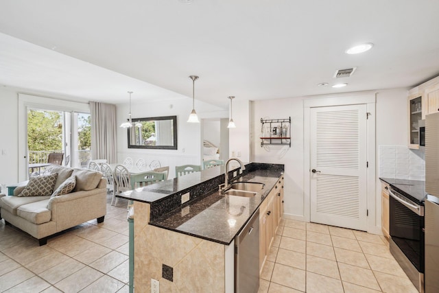 9100 Baytowne Wharf Blvd Unit 366-8, Miramar Beach, FL 32550 - kitchen with a sink, light tile patterned floors, stainless steel appliances, open floor plan, and hanging light fixtures