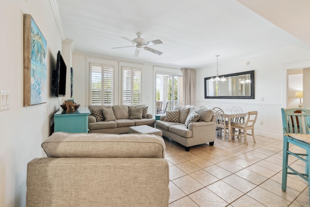 9100 Baytowne Wharf Blvd Unit 366-8, Miramar Beach, FL 32550 - living room featuring light tile patterned floors, a ceiling fan, a chandelier, crown molding, and a wainscoted wall