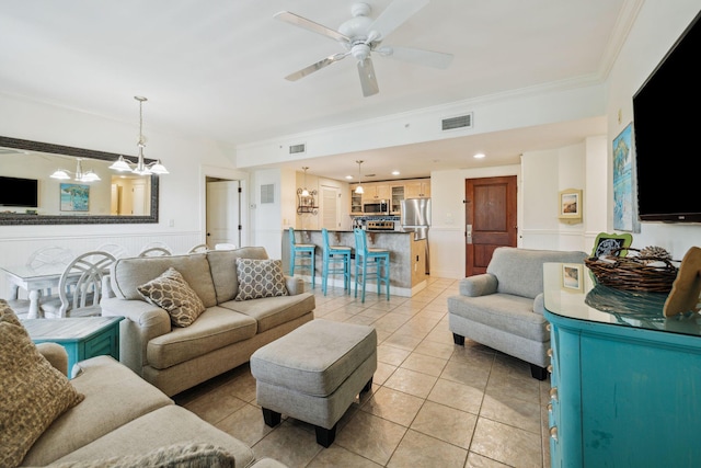 9100 Baytowne Wharf Blvd Unit 366-8, Miramar Beach, FL 32550 - living area with crown molding, light tile patterned floors, ceiling fan, a chandelier, and a wainscoted wall