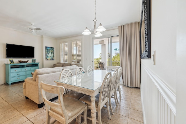 9100 Baytowne Wharf Blvd Unit 366-8, Miramar Beach, FL 32550 - dining room featuring light tile patterned floors, a chandelier, ceiling fan, and ornamental molding