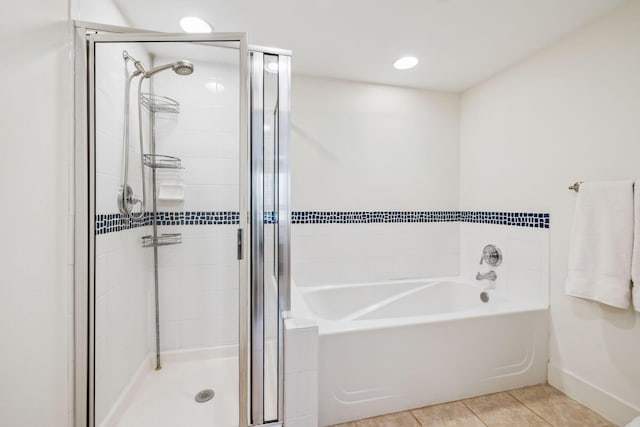 9100 Baytowne Wharf Blvd Unit 366-8, Miramar Beach, FL 32550 - bathroom with a stall shower, a bath, tile patterned flooring, and baseboards