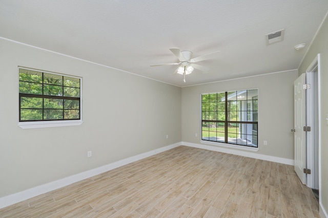 6859 Bill Lundy Rd, Laurel Hill, FL 32567 - empty room with plenty of natural light, light wood-type flooring, baseboards, and a ceiling fan
