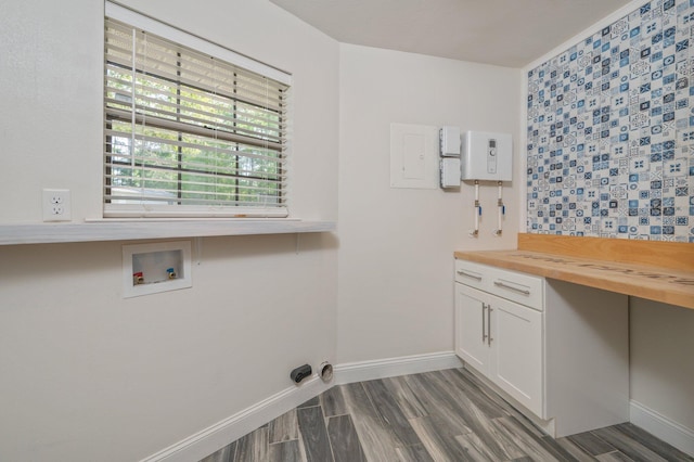 6859 Bill Lundy Rd, Laurel Hill, FL 32567 - laundry room featuring hookup for a washing machine, dark wood-type flooring, baseboards, and cabinet space
