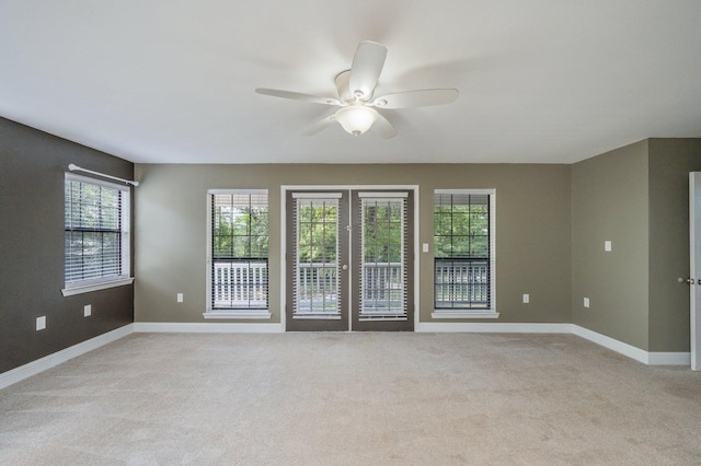 6859 Bill Lundy Rd, Laurel Hill, FL 32567 - empty room with a ceiling fan, light carpet, and baseboards