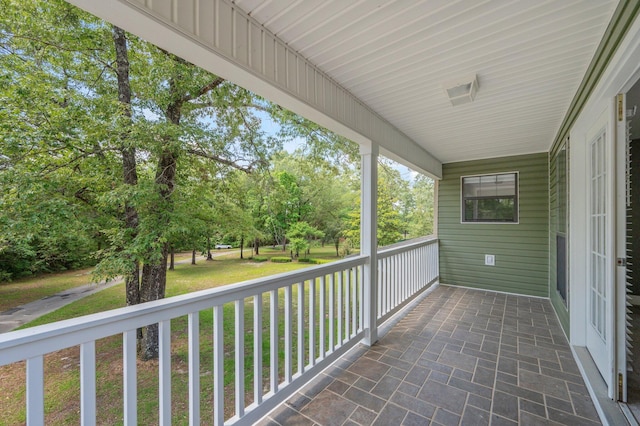 6859 Bill Lundy Rd, Laurel Hill, FL 32567 - covered porch with view of wooded area