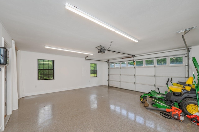 6859 Bill Lundy Rd, Laurel Hill, FL 32567 - garage featuring a garage door opener and baseboards