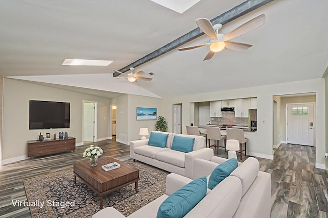 6859 Bill Lundy Rd, Laurel Hill, FL 32567 - living area featuring dark wood-type flooring, ceiling fan, and a skylight