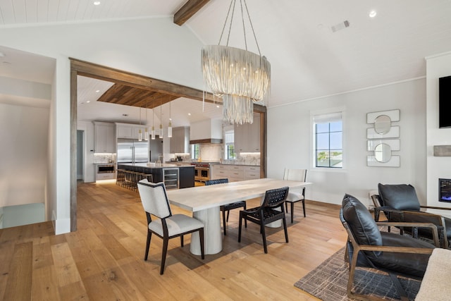5012 W County Highway 30a, Santa Rosa Beach, FL 32459 - dining space featuring light wood-type flooring, beverage cooler, a chandelier, and recessed lighting