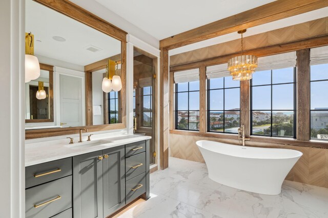 5012 W County Highway 30a, Santa Rosa Beach, FL 32459 - bathroom with vanity, a freestanding bath, a chandelier, and marble finish floors