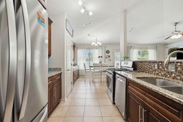 187 Sandy Cay Dr, Miramar Beach, FL 32550 - kitchen featuring stainless steel appliances, a sink, light tile patterned floors, a ceiling fan, and plenty of natural light