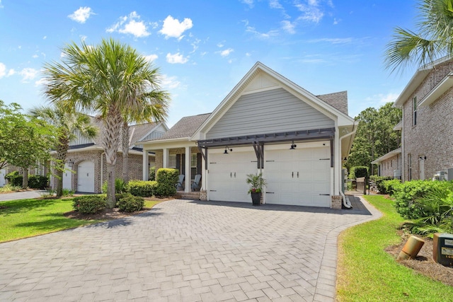 327 Cobalt Ln, Miramar Beach, FL 32550 - ranch-style house with an attached garage, decorative driveway, a front yard, and brick siding