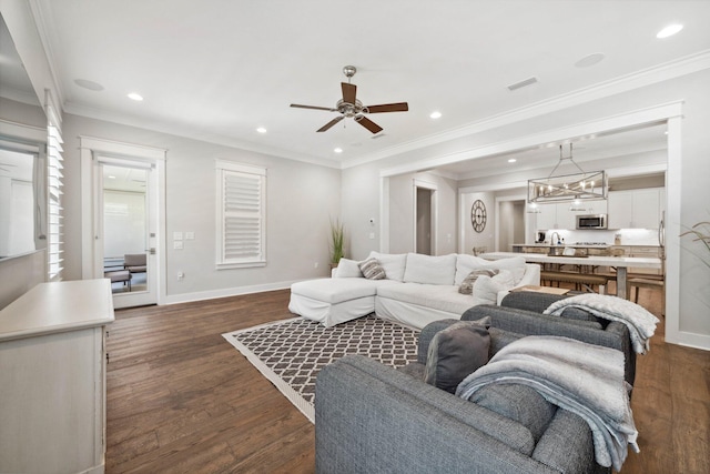 327 Cobalt Ln, Miramar Beach, FL 32550 - living room with dark wood-style floors, ceiling fan, baseboards, recessed lighting, and ornamental molding