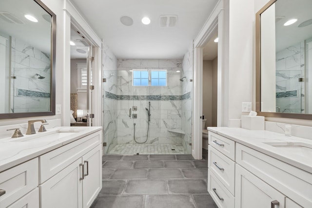 327 Cobalt Ln, Miramar Beach, FL 32550 - full bath with a marble finish shower, two vanities, recessed lighting, and toilet