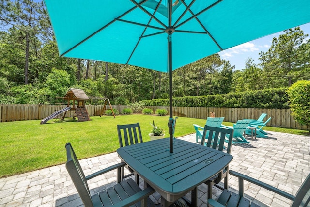 327 Cobalt Ln, Miramar Beach, FL 32550 - view of patio / terrace with outdoor dining space and a playground