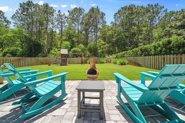 327 Cobalt Ln, Miramar Beach, FL 32550 - view of patio featuring a playground and an outdoor fire pit