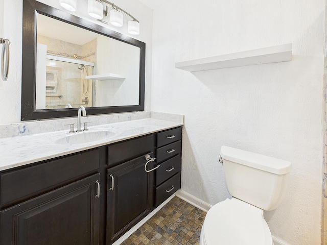 1000 Bay Dr Unit 524, Niceville, FL 32578 - full bath featuring toilet, vanity, a shower with shower door, and baseboards
