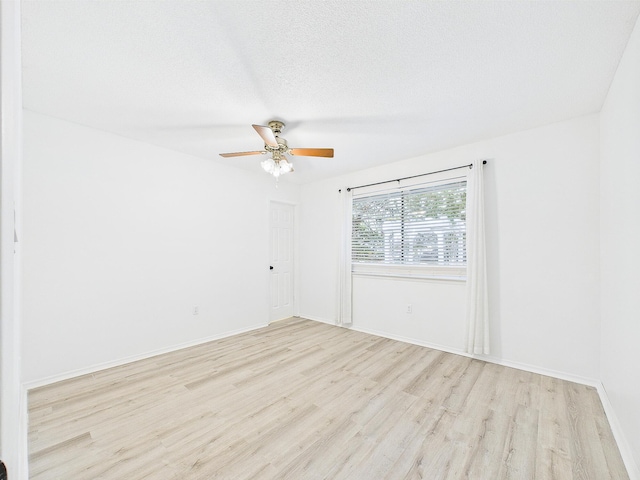 1000 Bay Dr Unit 524, Niceville, FL 32578 - unfurnished room with light wood-type flooring, a ceiling fan, and baseboards